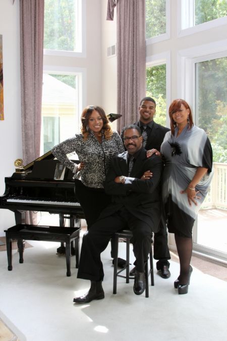 Drew Sheard II in a black shirt poses with father John Drew Sheard, sister Kierra  Sheard and mother Karen Clark Sheard. 